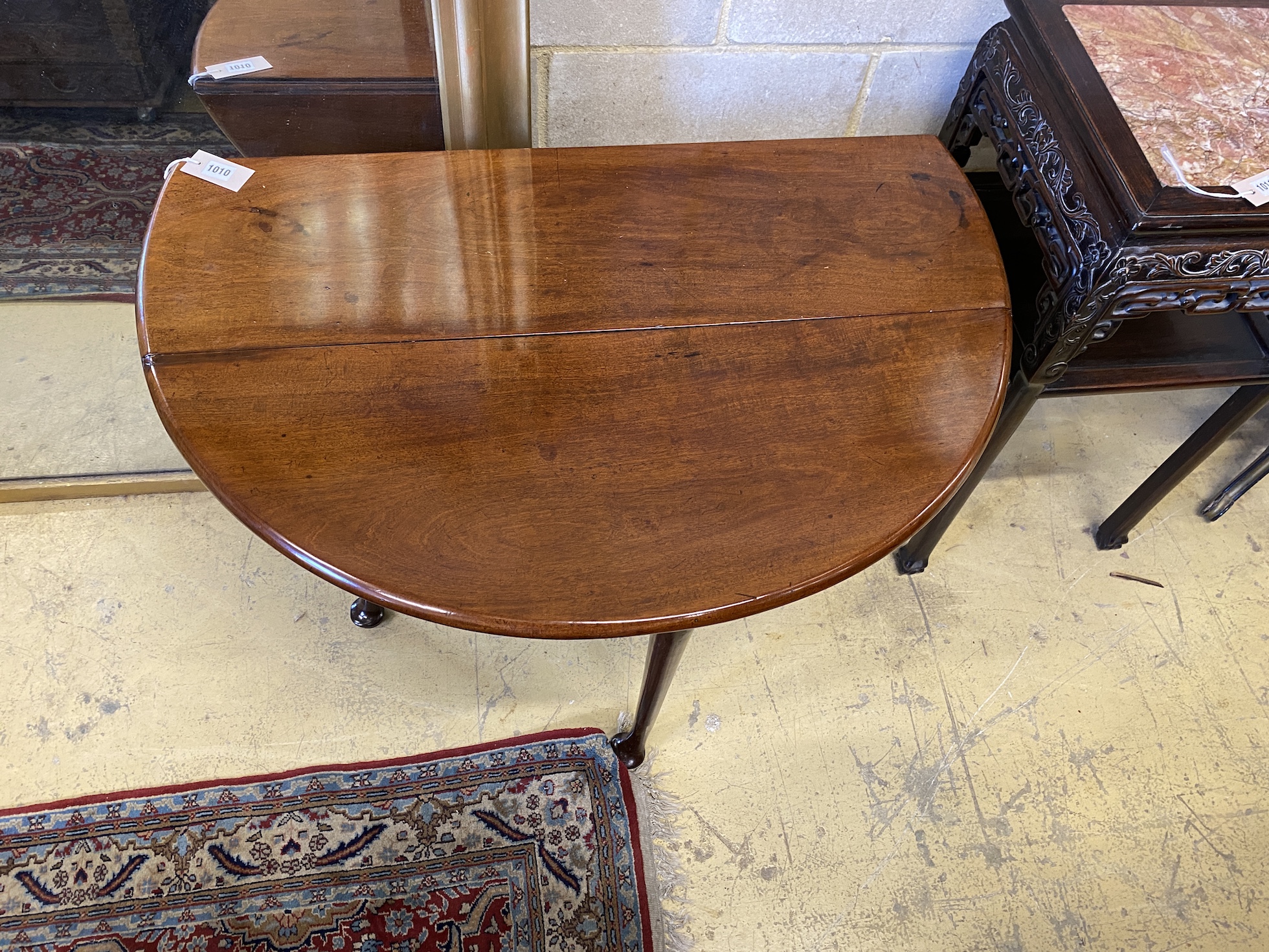 A small George III mahogany pad foot drop leaf table, 92cm extended, width 92cm, height 71cm